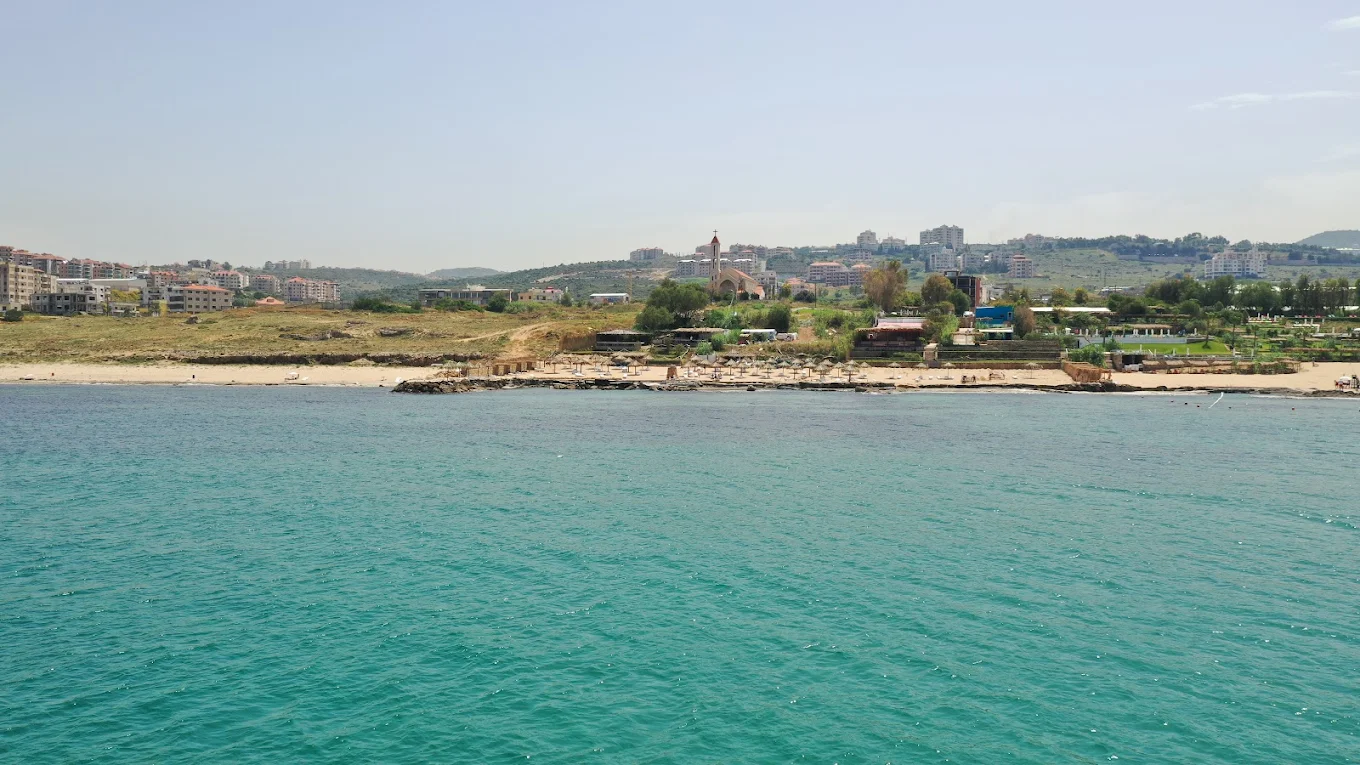 Side B beach seen from the sea with Jiyeh village behind
